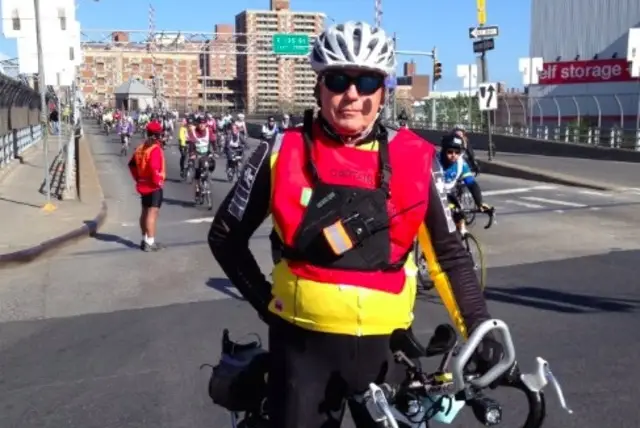 Schlicting in his capacity as a a captain of the Five Boro Bike Tour in 2013